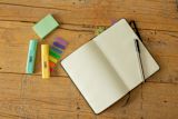 Decorative image of a book and stationary