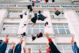 Decorative image of graduate caps being thrown for article