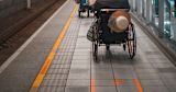 Decorative image of train platform with wheelchair users on for article