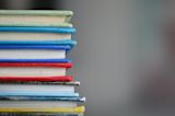 Decorative image of a stack of books for An introduction to policymaking lesson 4.3