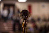 Microphone facing towards speaker