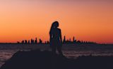 Decorative image of woman's silhouette infront of sunset for article