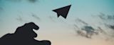 Decorative image of a hand throwing a paper aeroplane towards the sky for article