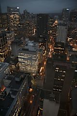 Aerial night view of city skyline and streets