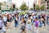 Decorative long exposure image of street with pedestrians for article