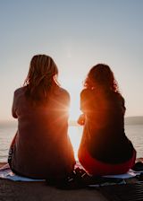 Decorative image of sunlight shining through two women's silhouettes for article