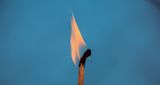 Decorative image of match burning for article