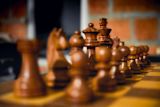 Decorative image of chess pieces for article