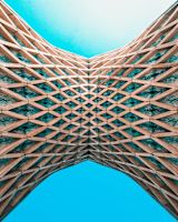 Image of two large geometric patterned structures joining in the center of the image for this article.