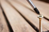 Decorative image of screw and screwdriver for article