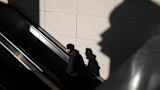 man on escalator