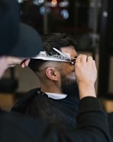 Man getting a haircut at barber