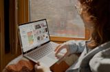 person looking happy about a laptop