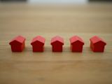 Decorative image of monopoly houses for article