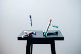 Whiteboard pens falling through the air