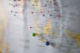 Decorative image of pins on a map for article