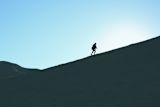 Man walking up mountain