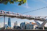 Decorative image of people walking with Tower Bridge in the background for article
