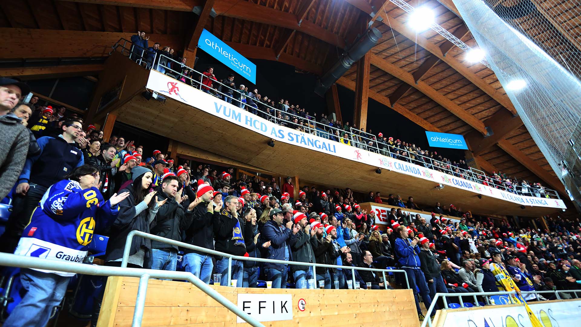 RhB employees at the HCD Davos stadium in front of a packed grandstand