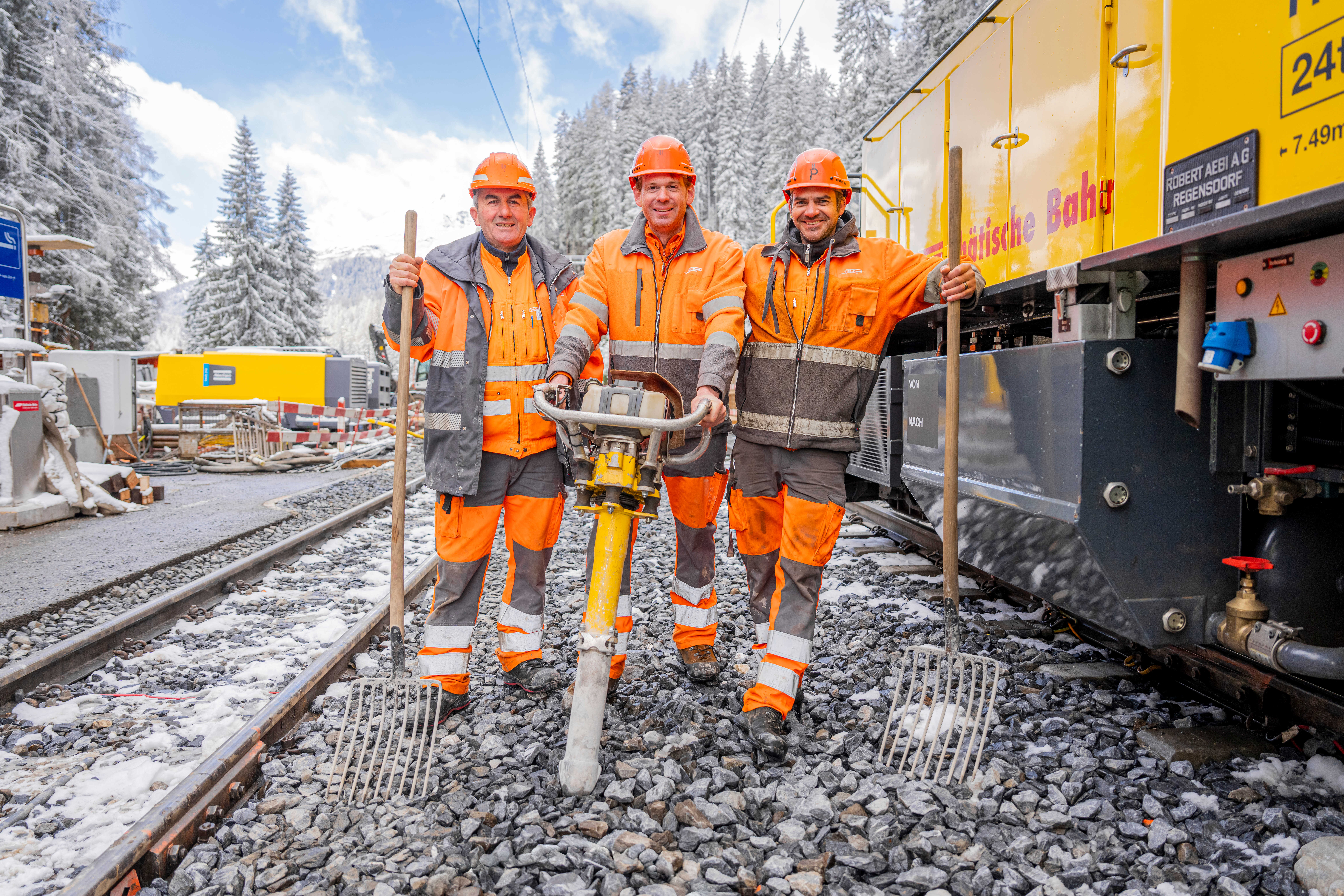 Three track layers working as a team in Davos Laret
