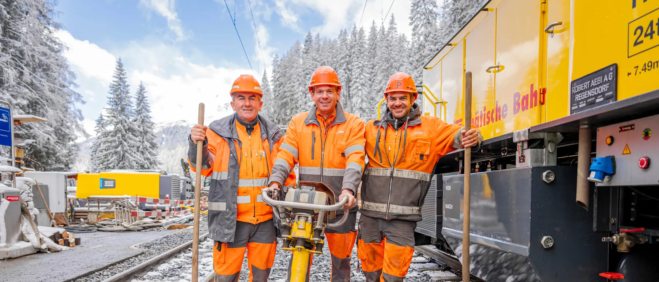 Three track layers working as a team in Davos Laret