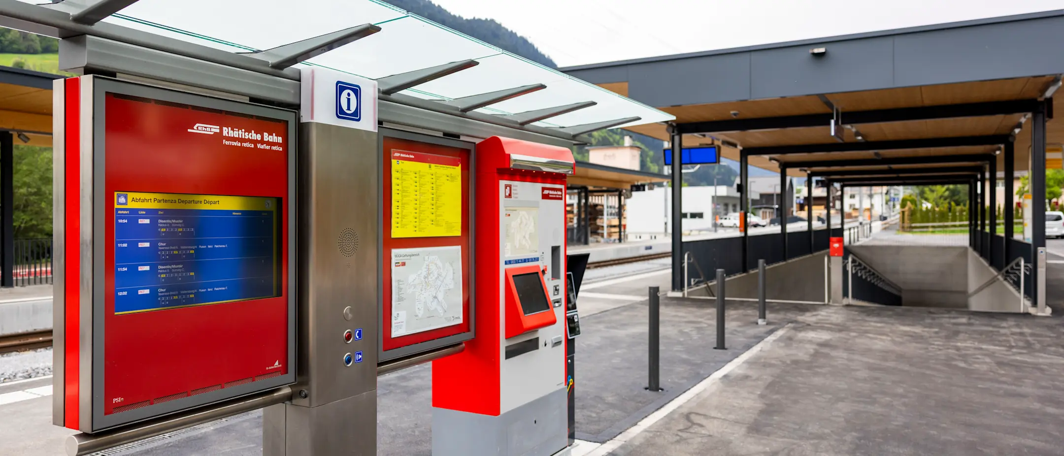 Ticket machine and train's information system of the Rhaetian Railway at Trun station – modern, covered and easily accessible