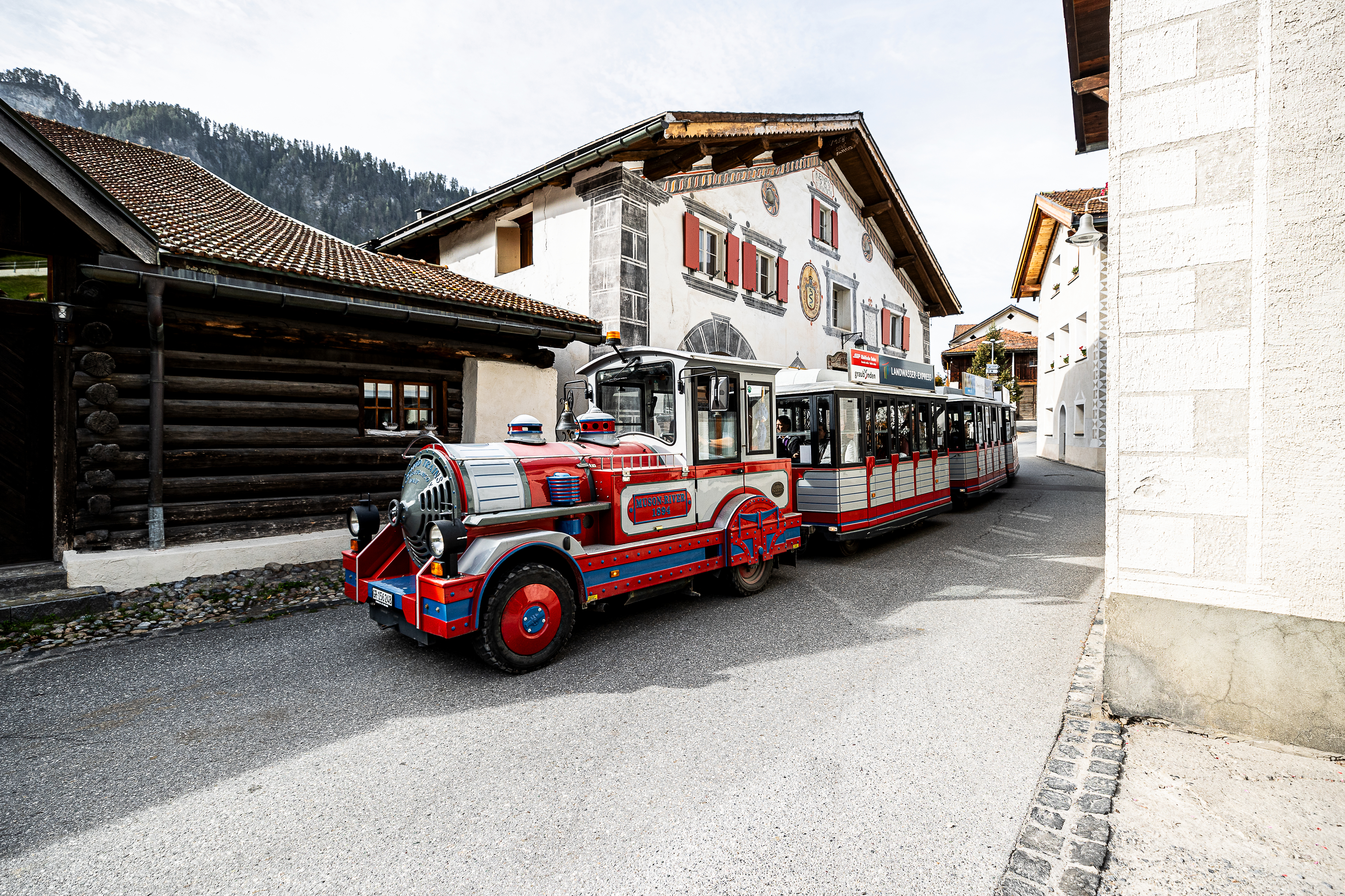 The Rhaetian Railway’s Landwasser Express travels through Filisur on its way to the Landwasser Viaduct.