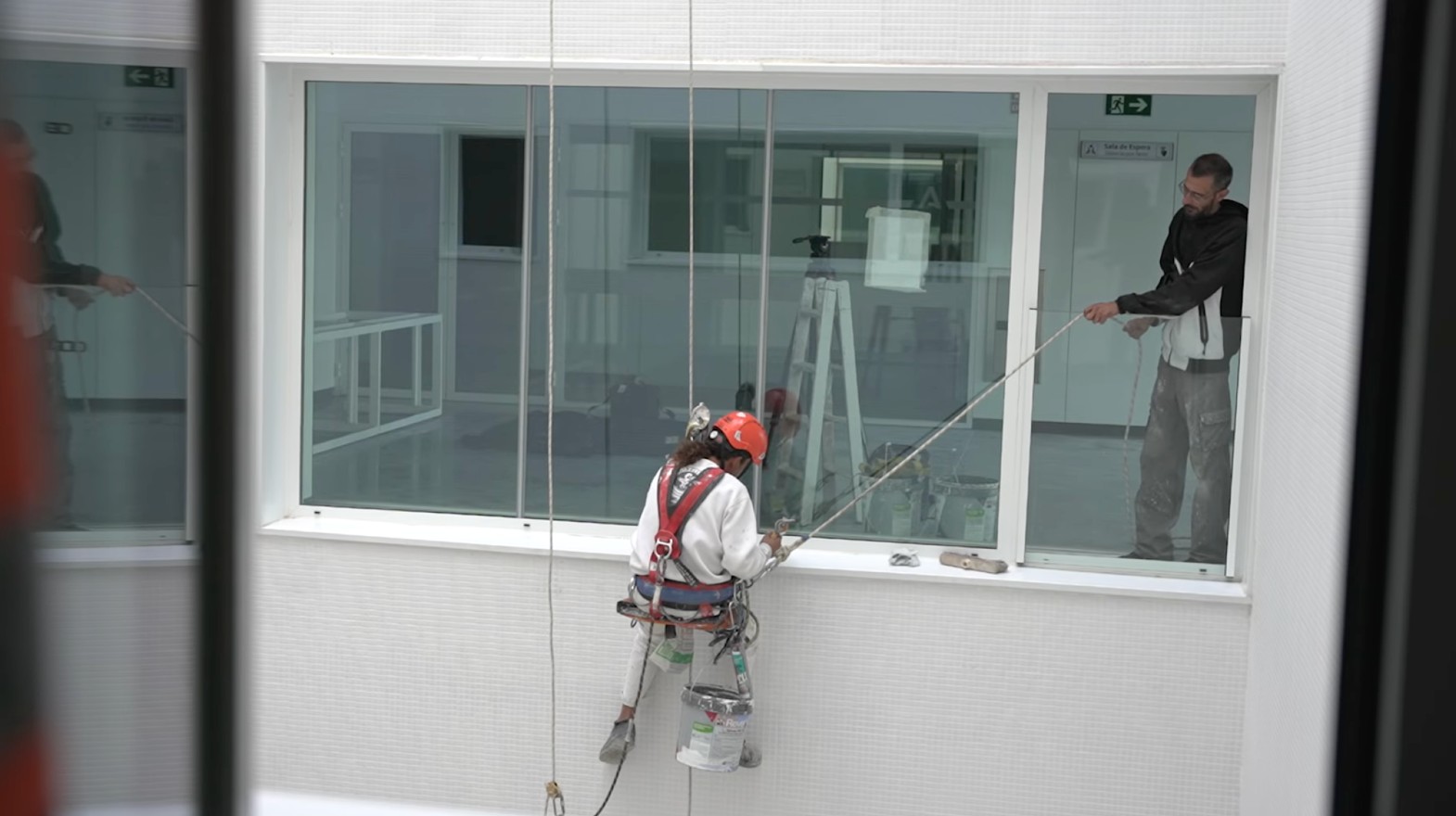 Construction worker painting on a jobsite.