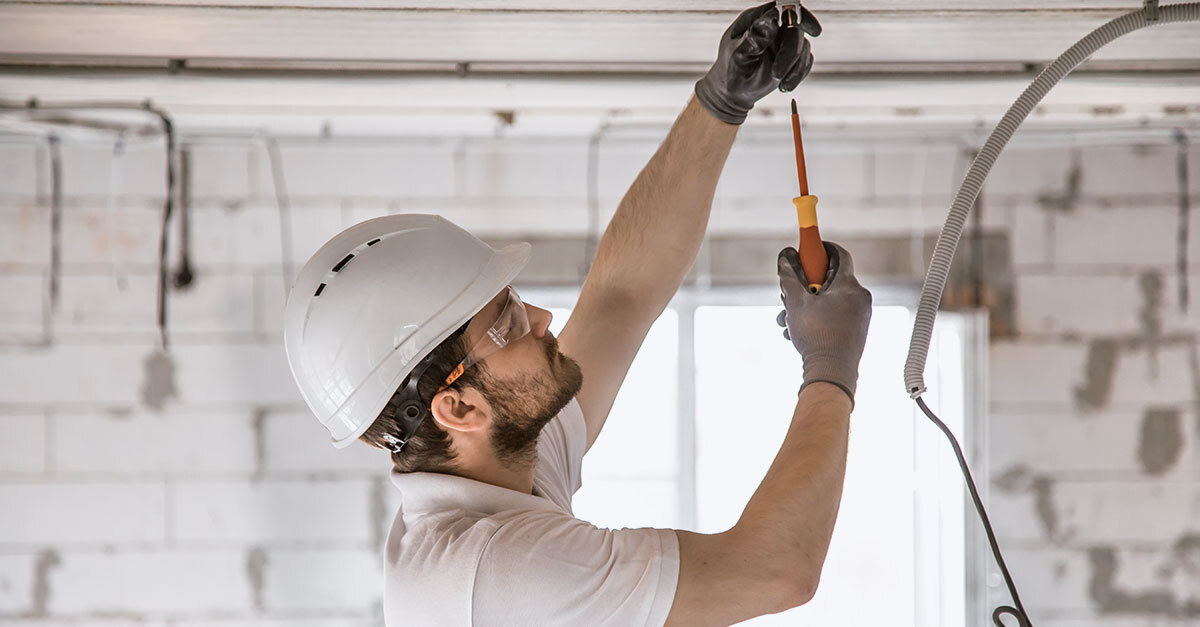 An electrician working on a jobsite
