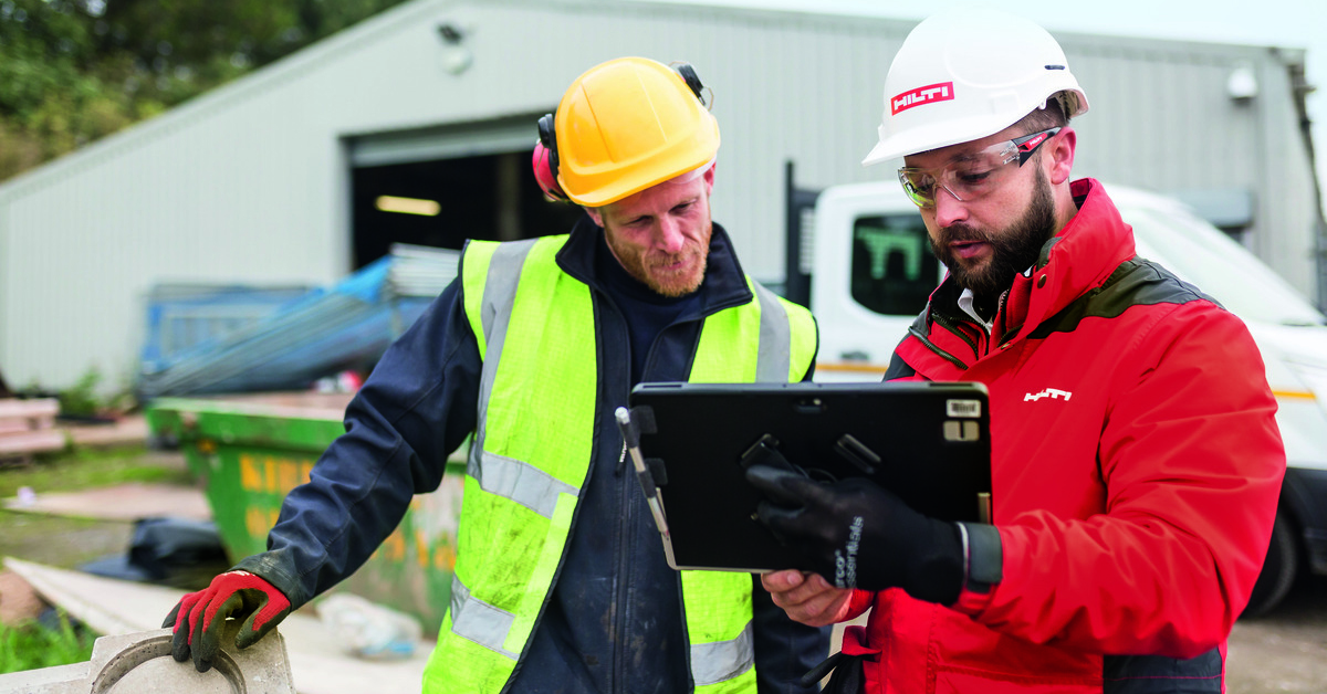 Contractors using a software for construction management on the jobsite