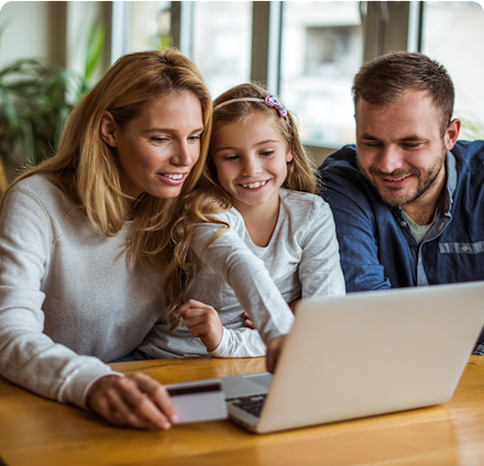 A family sat around a computer