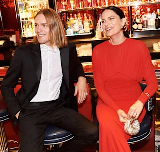 Two people smiling at a party