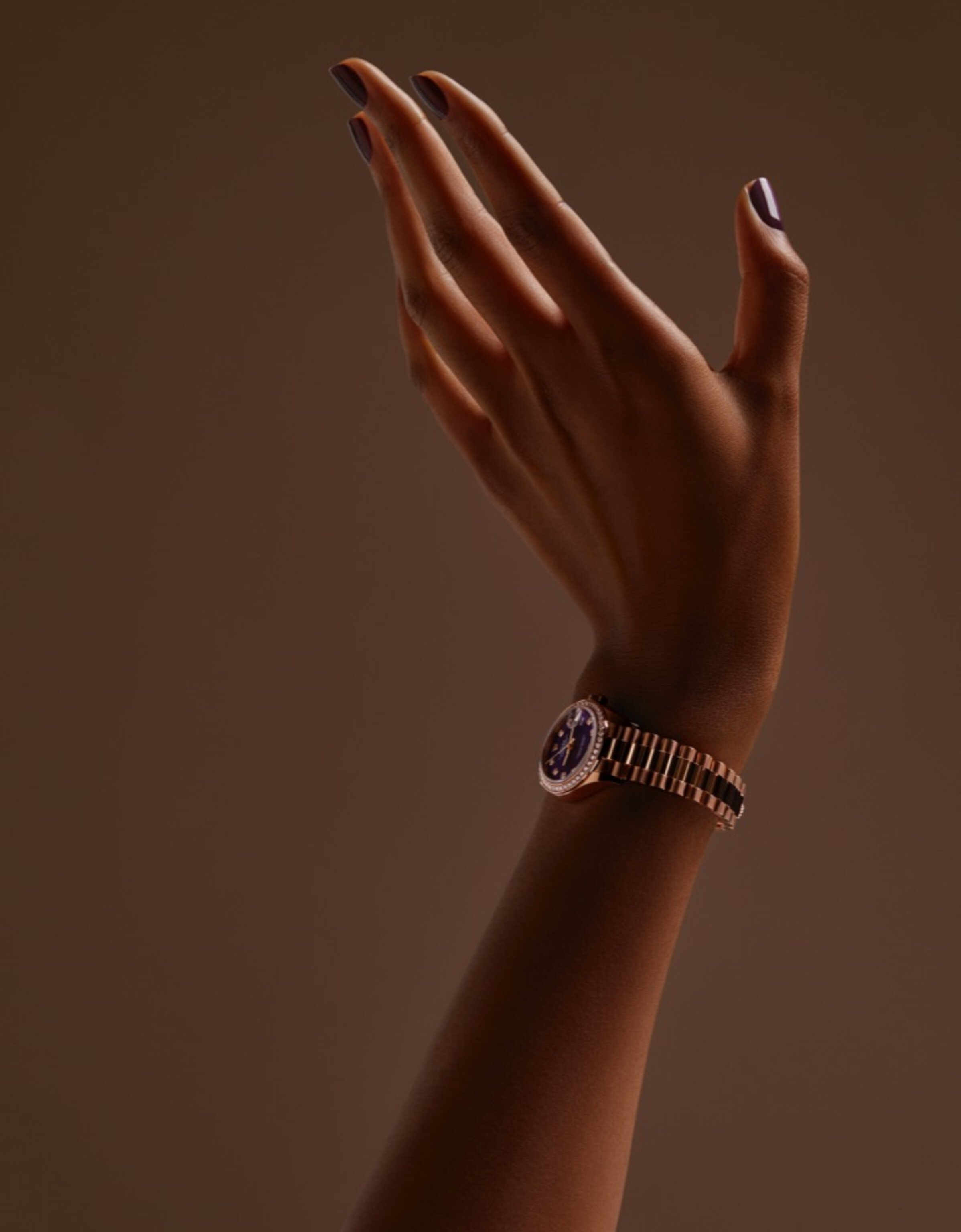 Female hand wearing Rolex Lady-Datejust watch