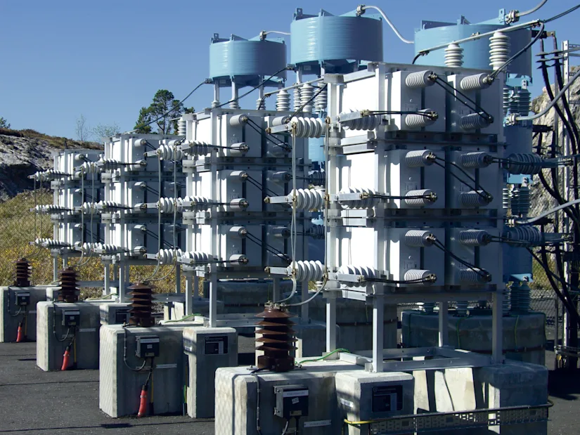 Capacitor banks in a high-voltage substation for power compensation and grid stabilization.