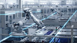 Industrial robots automate production in a modern factory.