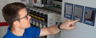 Modern servers in the data center with blue lighting for data storage and processing.