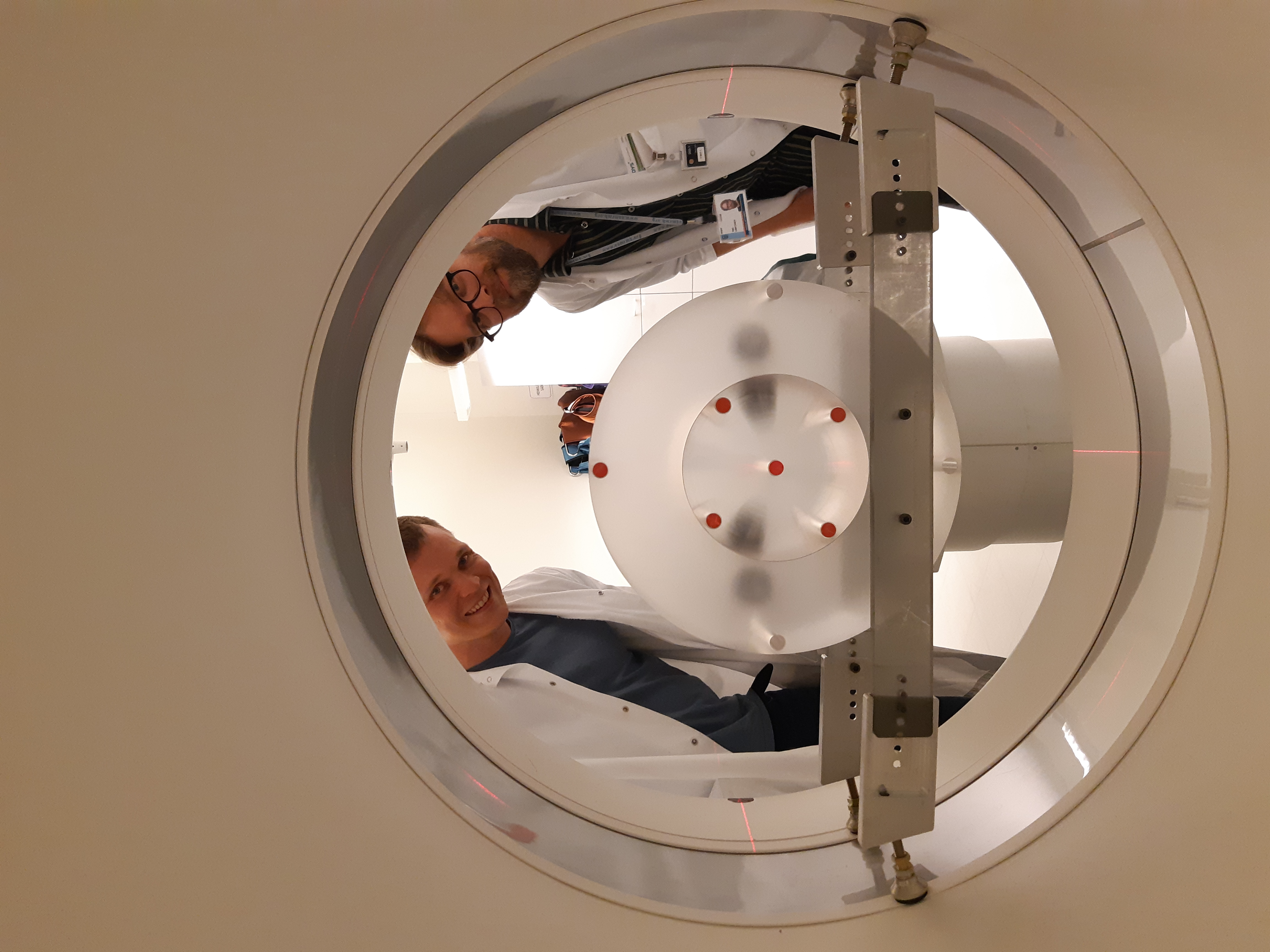 Physicists performing a CT scanner quality assurance test