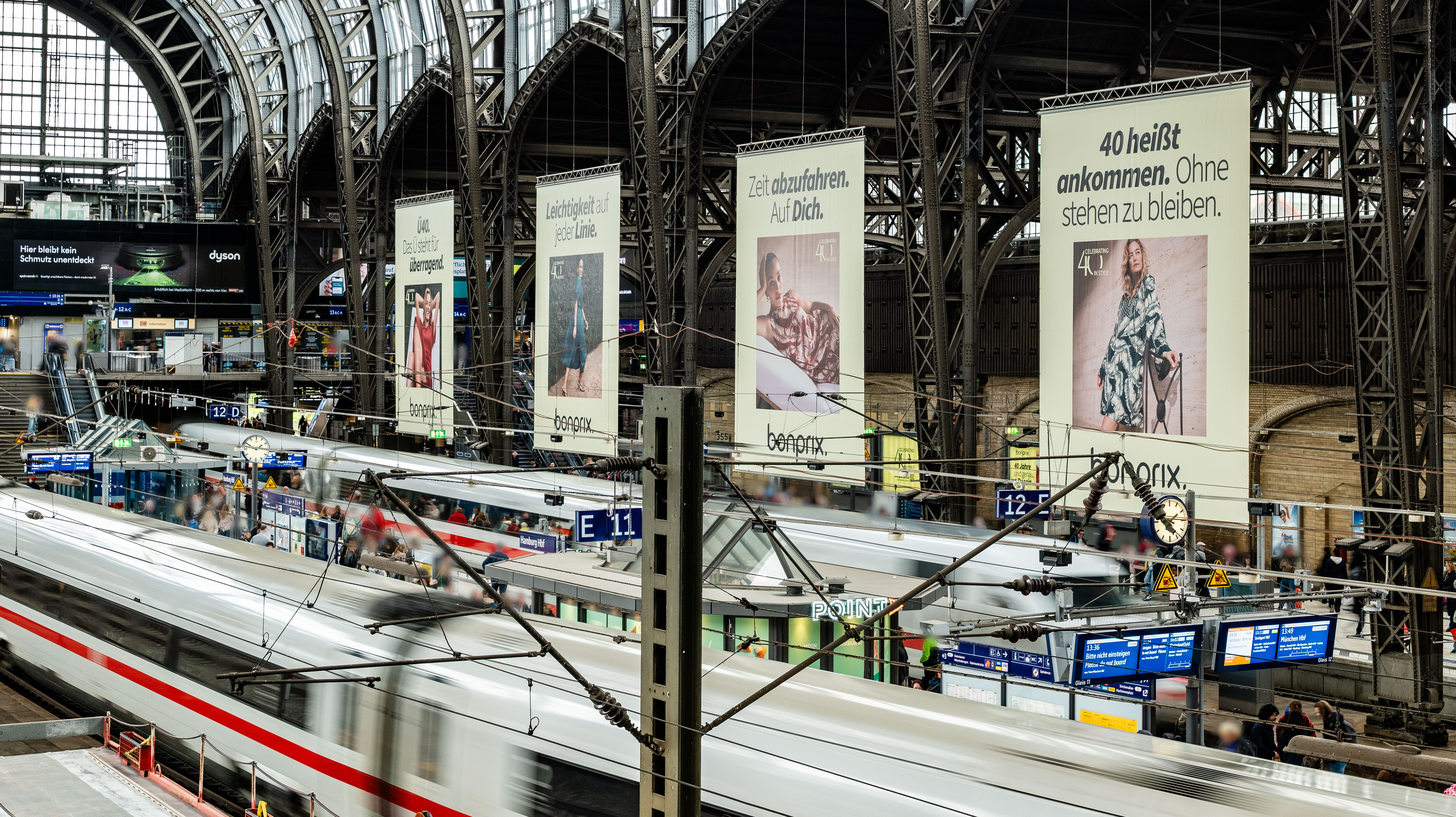 Large advertising banners for the bonprix birthday campaign at Hamburg Central Station.