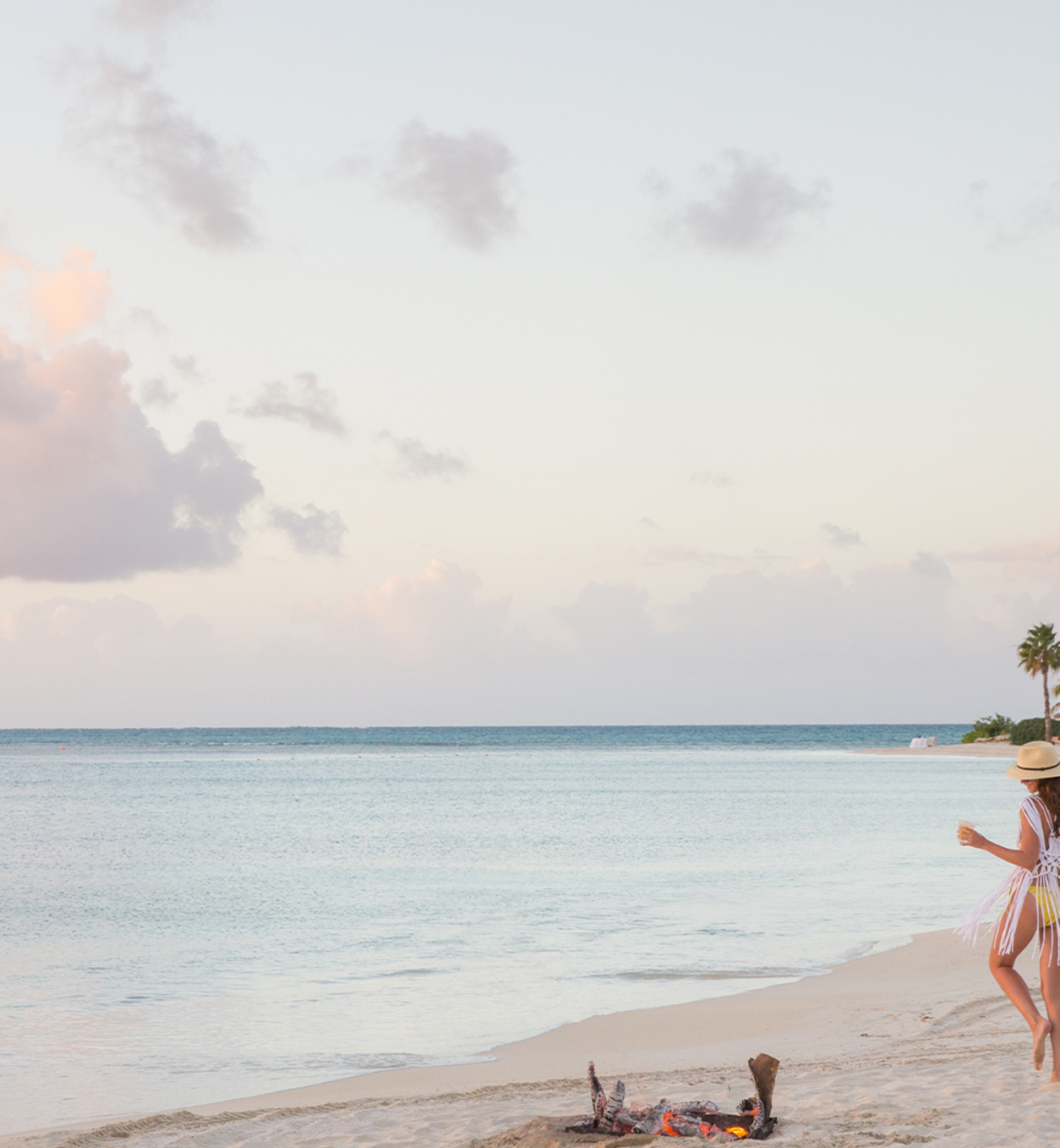 JBI - Woman walking on the beach