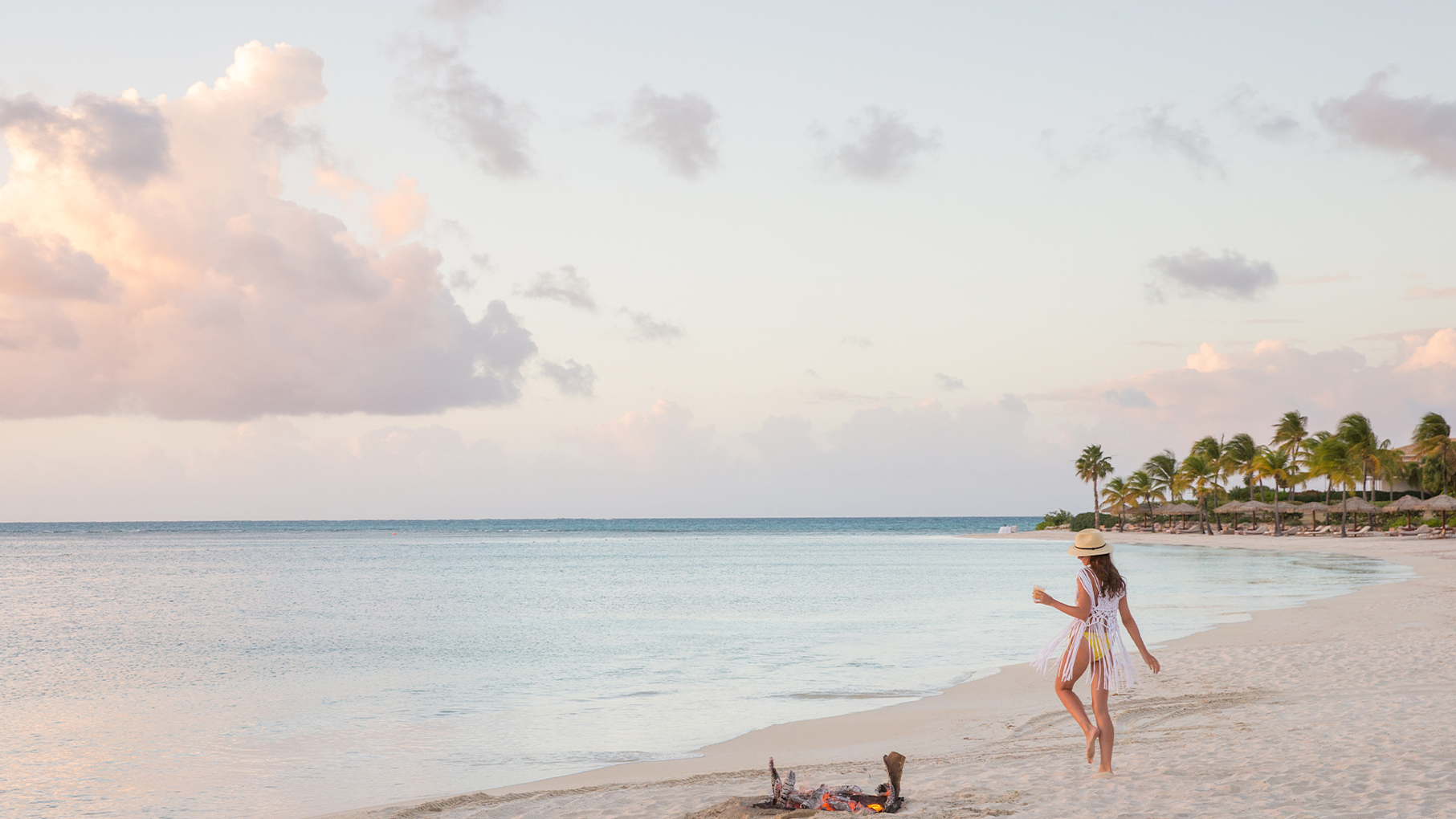 JBI - Woman walking on the beach