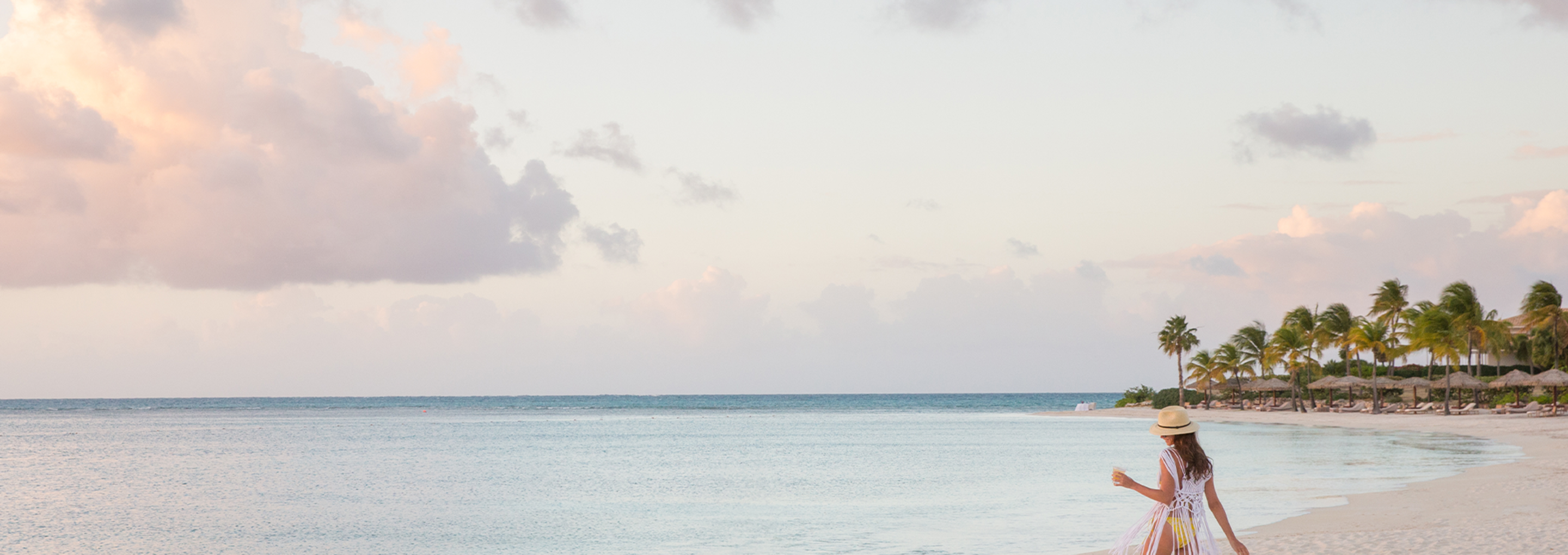 JBI - Woman walking on the beach
