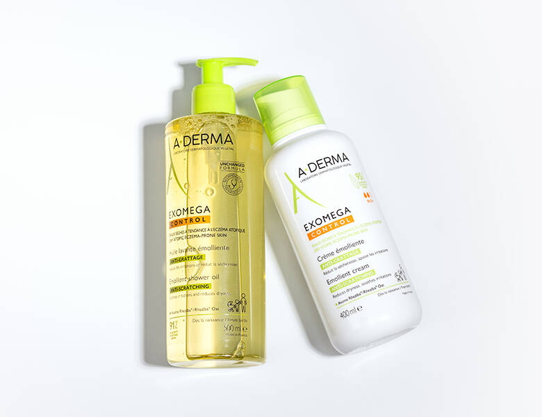 Her ses to produkter fra A-DERMA, som ligger på en hvid baggrund.