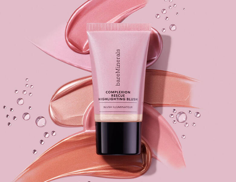 Her ses en lyserød baggrund med et lyserødt bareMinerals produkt.