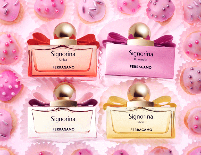 Her ses fire forskellige Ferragamo Signorina parfumer omgivet af lyserøde cupcakes.