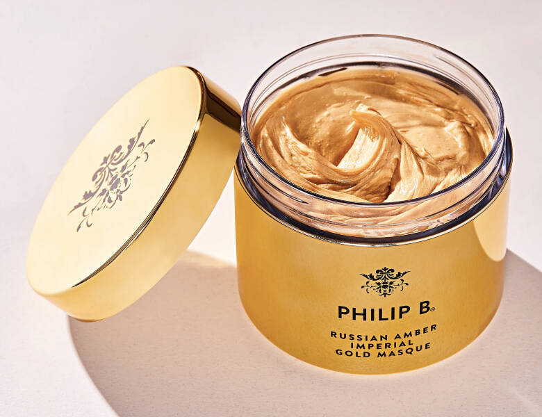 Her ses et guld produkt fra Philip B på en lys baggrund. 