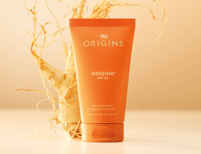 Her ses et orange produkt med en rod. Baggrunden er lys.