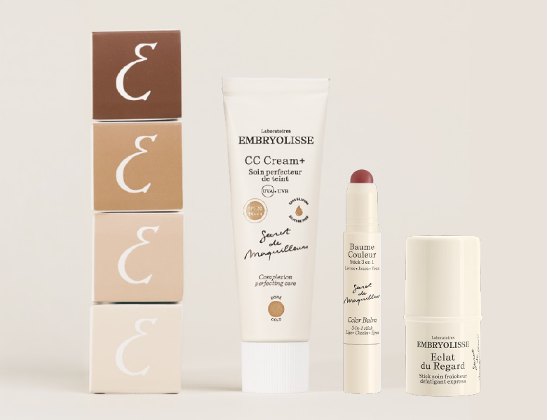 Her ses Embryolisse CC Cream+, Baume Couleur og Éclat du Regard sammen med fire æsker mod en lys beige baggrund.