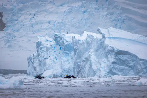 Expedition boat cruising in Neko Harbour, Antarctica. Credit: Expedition boat cruising in Neko Harbour, Antarctica.