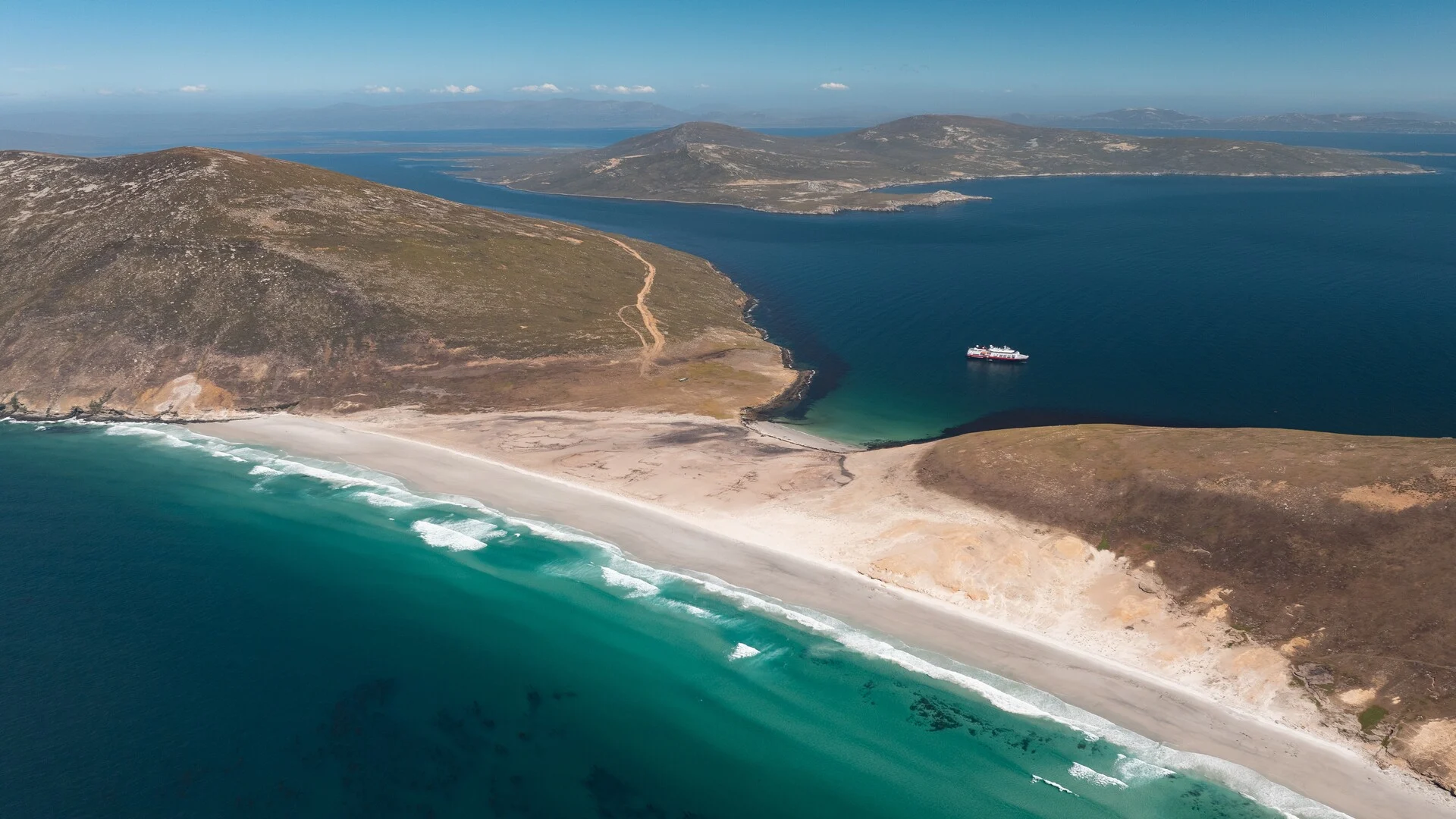 MS Fram at the coast of Saunders Island, Falklands Islands. Credit: Yuri Choufour / HX Hurtigruten Expeditions