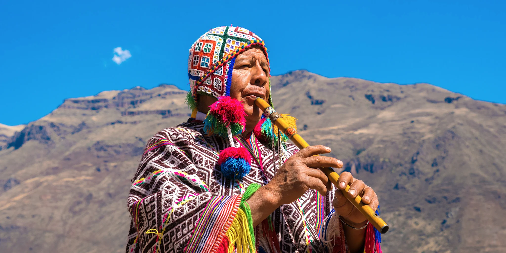 day-11_man-playing-flute_sacred-valley_cusco-peru_shutterstock.jpg
